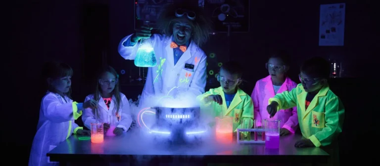 Children watching a science demonstration with coloured smoke